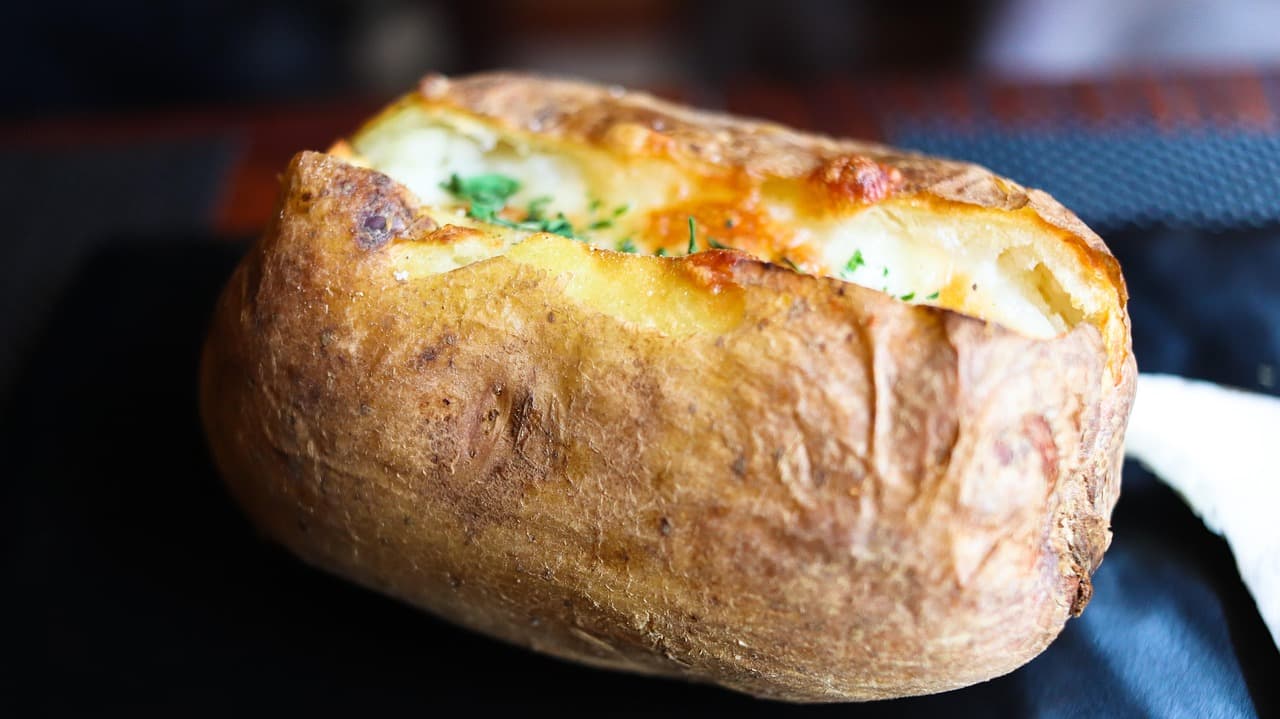 A jacket potato with melted cheese