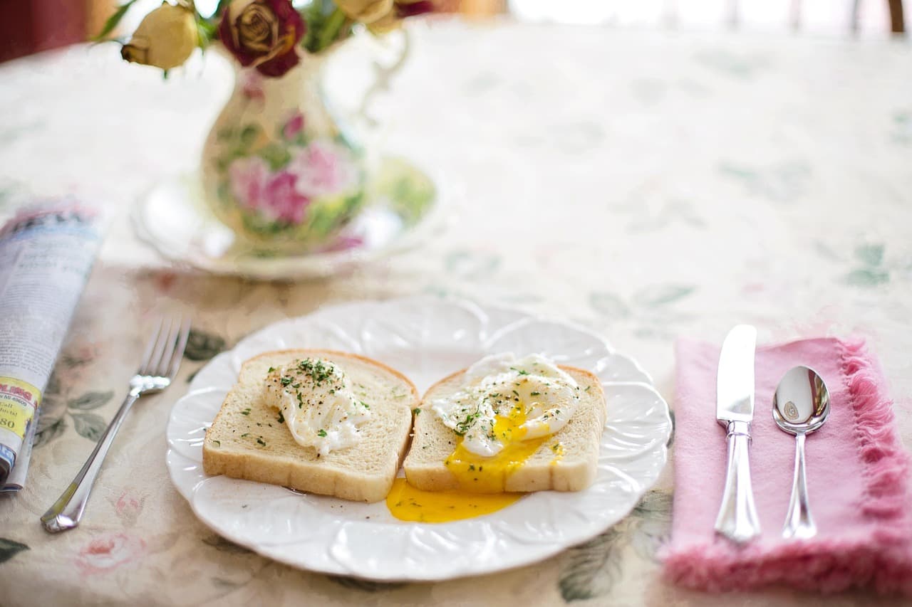 Poached eggs on toast on a white plate